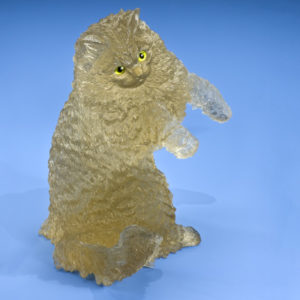 GIA: "This golden cat is carved in citrine from Brazil. Its eyes are made of peridot and gold. - Robert Weldon"